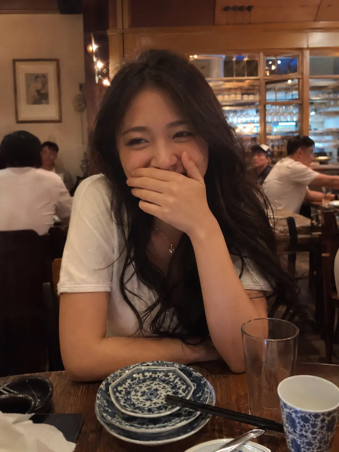 Shy Laugh Over Dinner