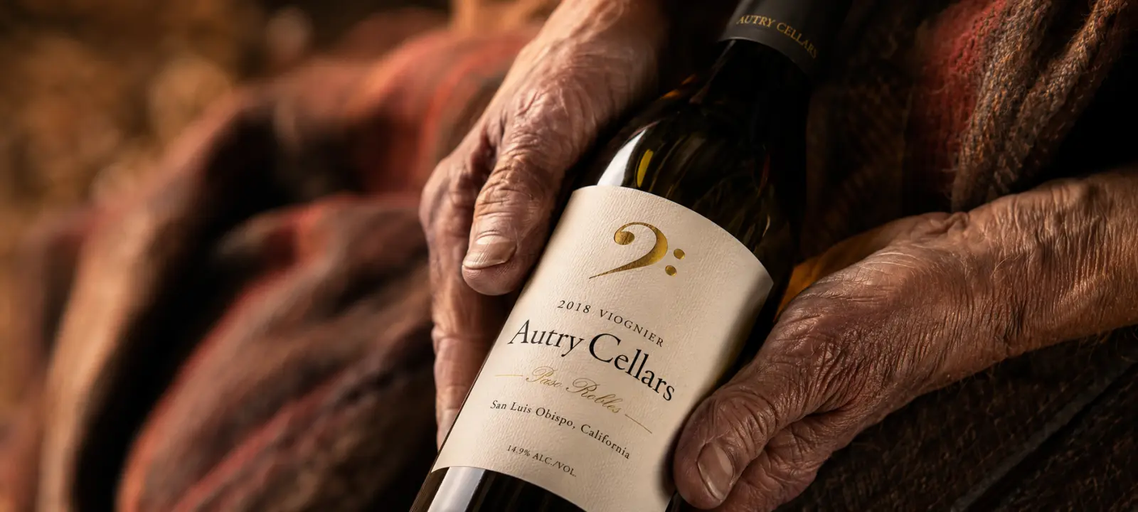 Rustic hands holding fine wine