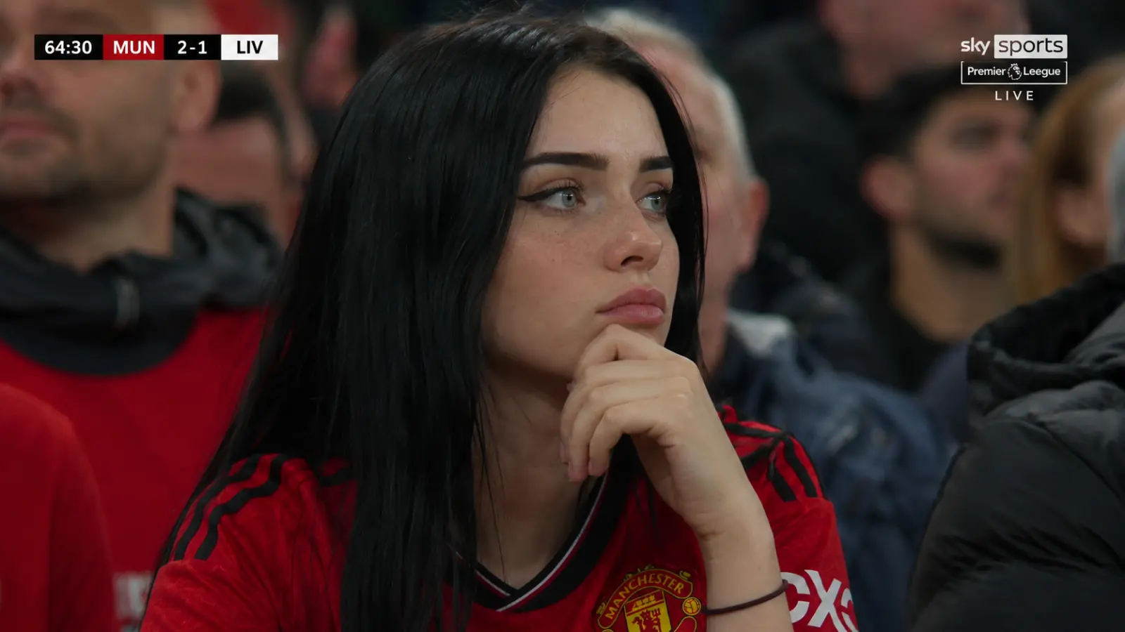 Pensive fan in the stands